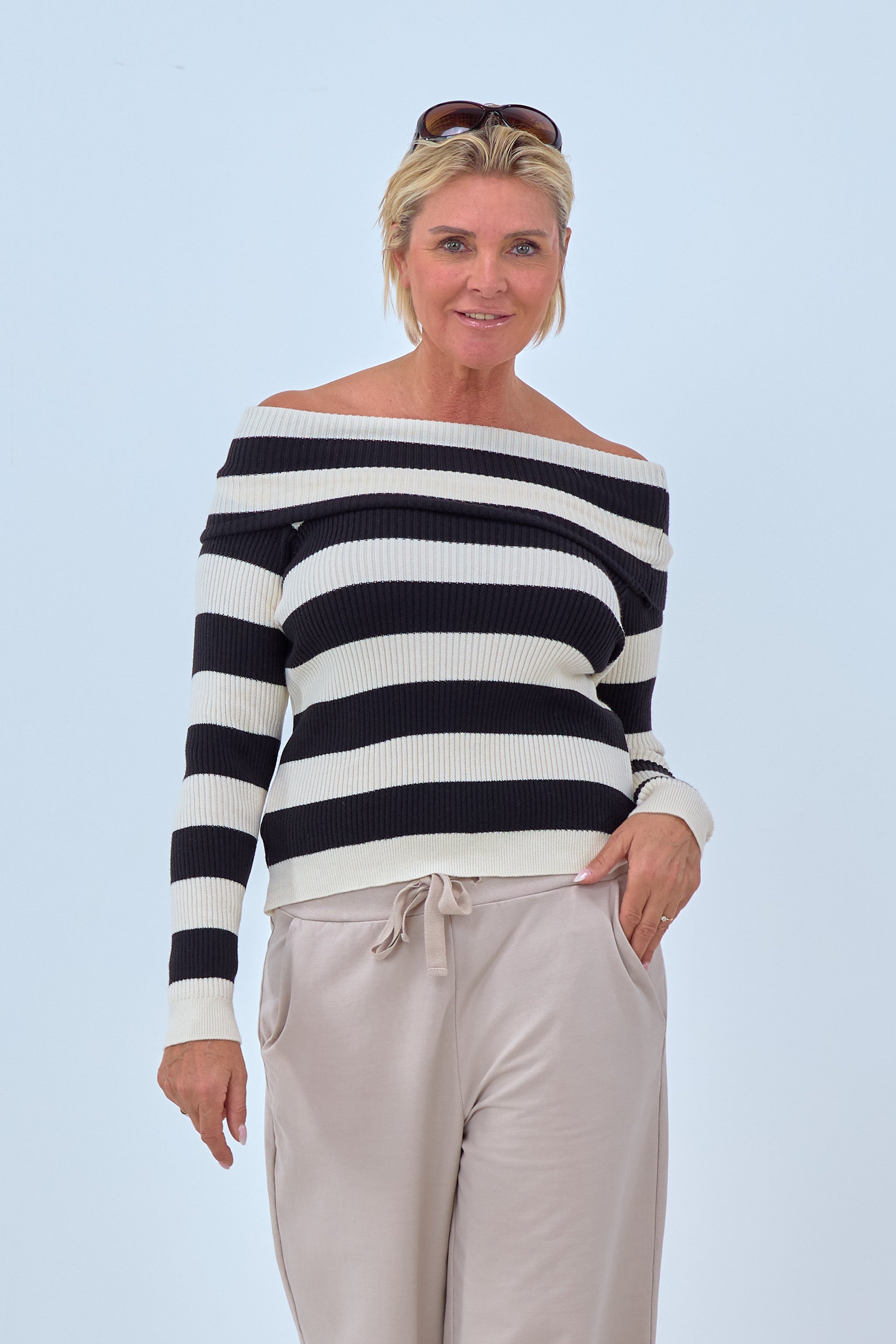 Off shoulder striped sweater with a Carmen neckline black