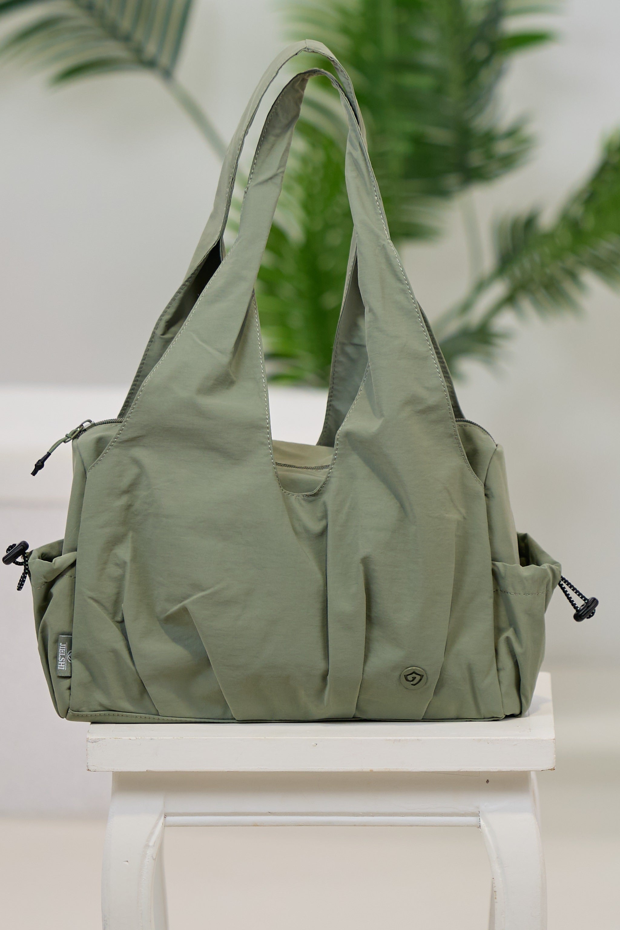 Henkeltasche mit Außenfächern, khaki