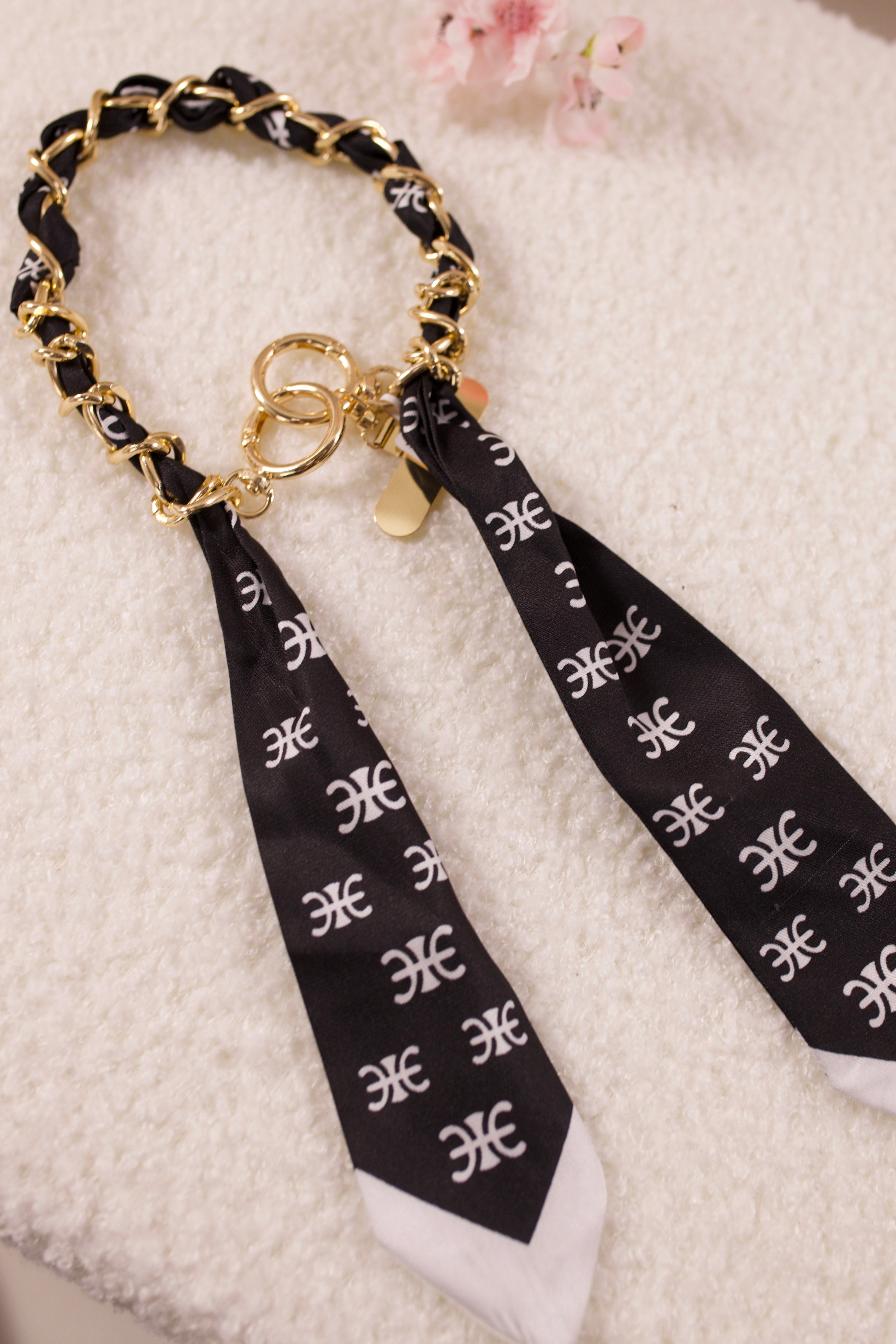 Handy-/Taschenanhänger, schwarz-weiß-gold