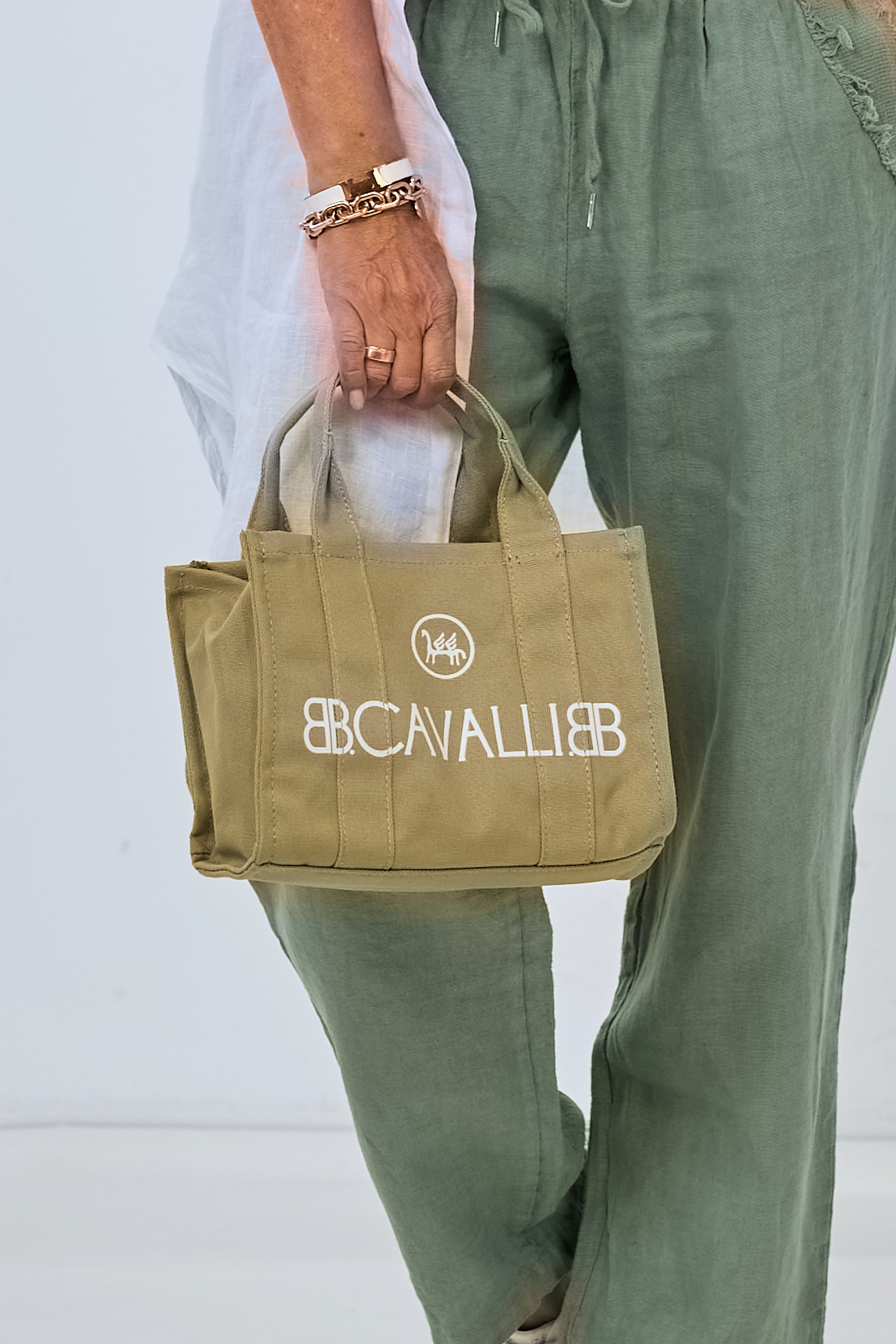 small canvas bag with lettering, mud