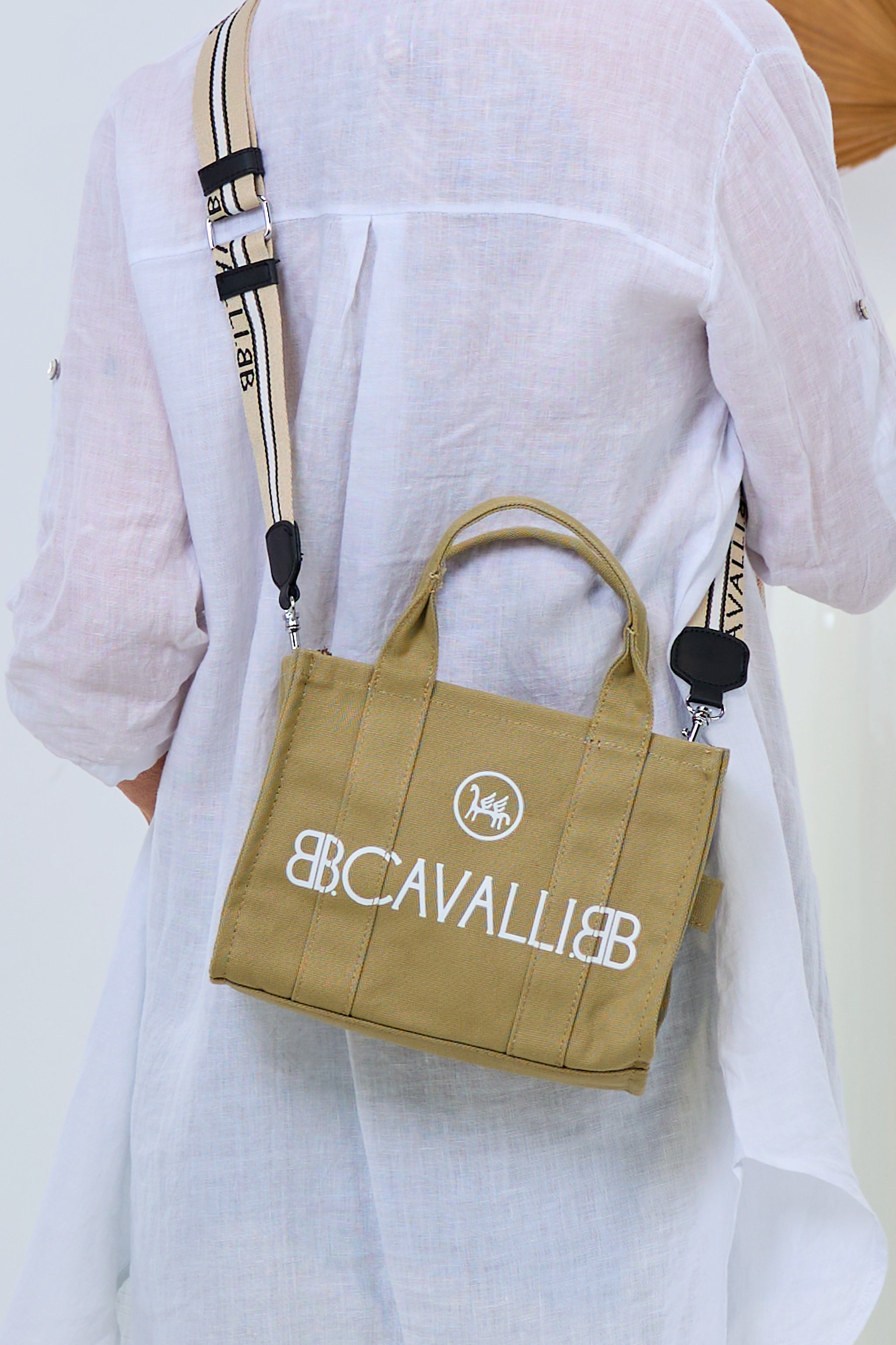 small canvas bag with lettering, mud