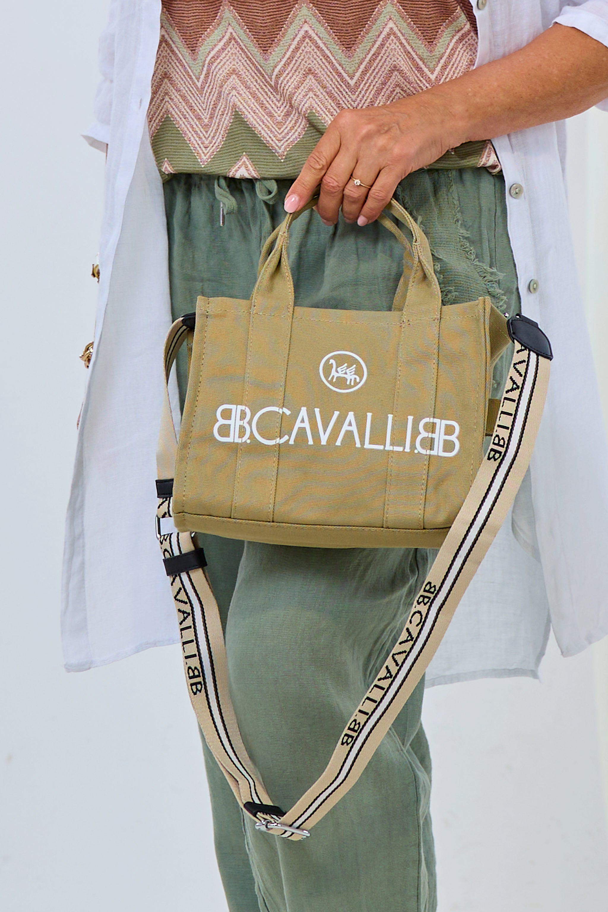small canvas bag with lettering, mud