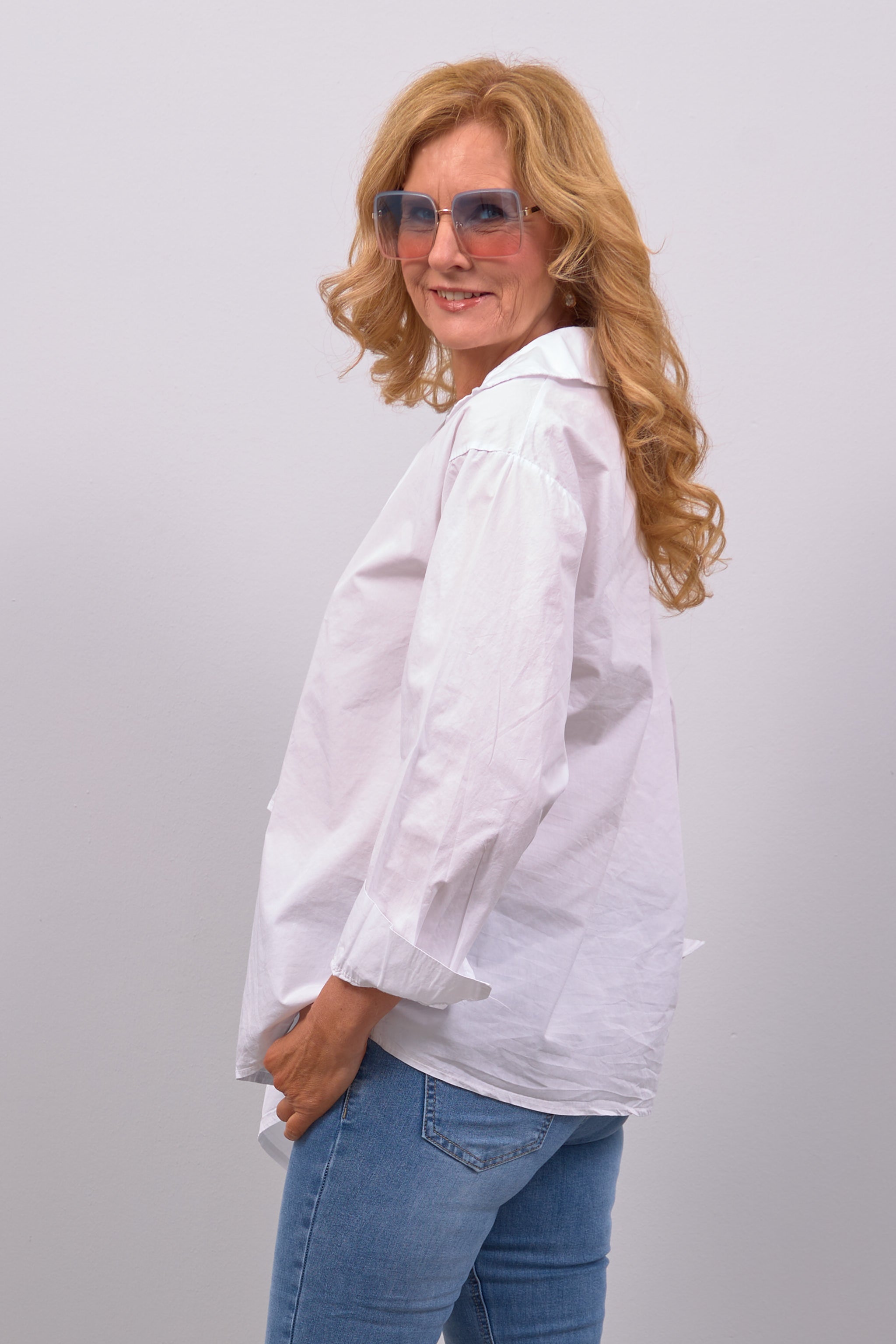 Long blouse with an asymmetrical cut, white