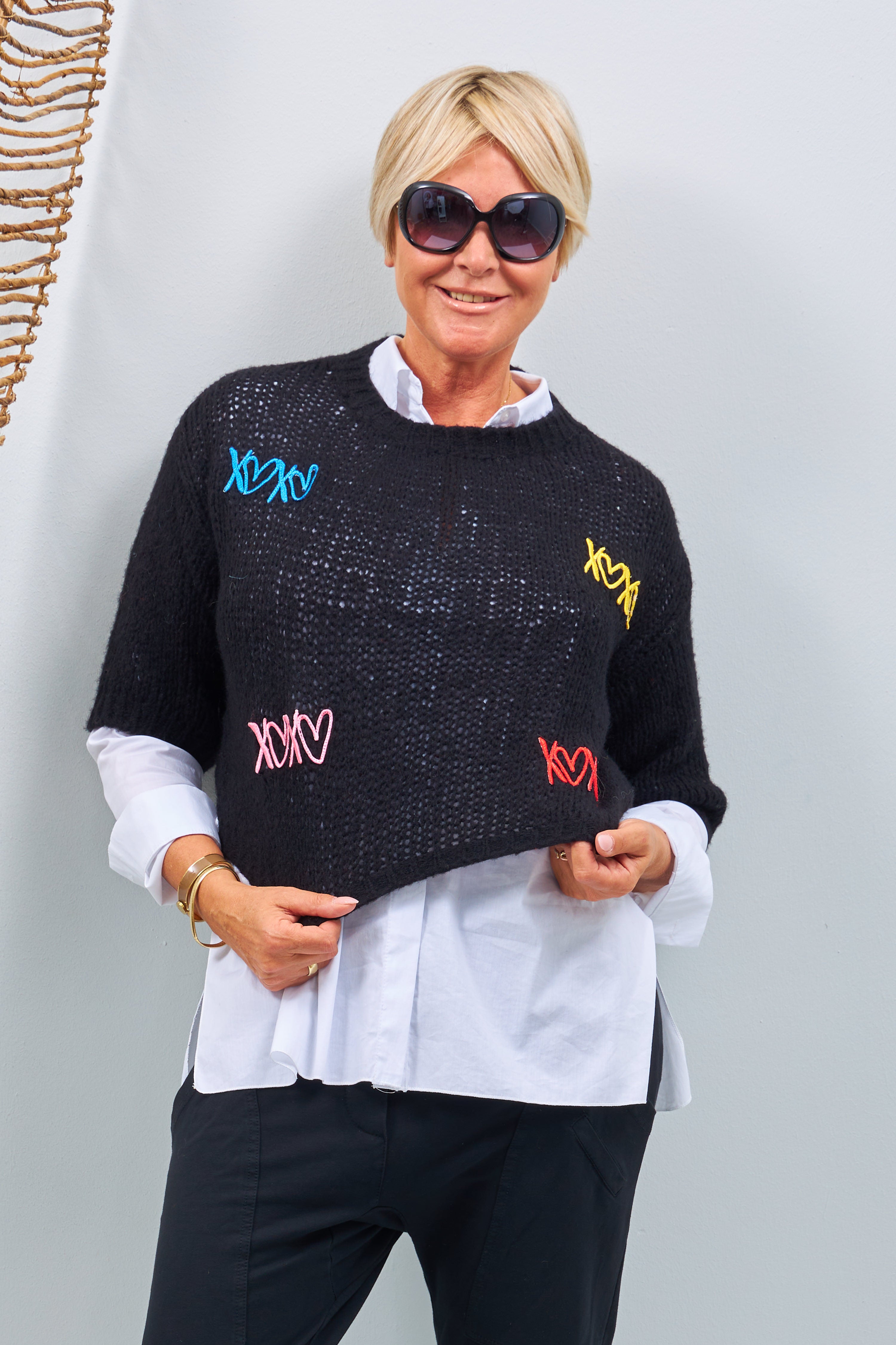 Knit sweater with embroidered hearts, black