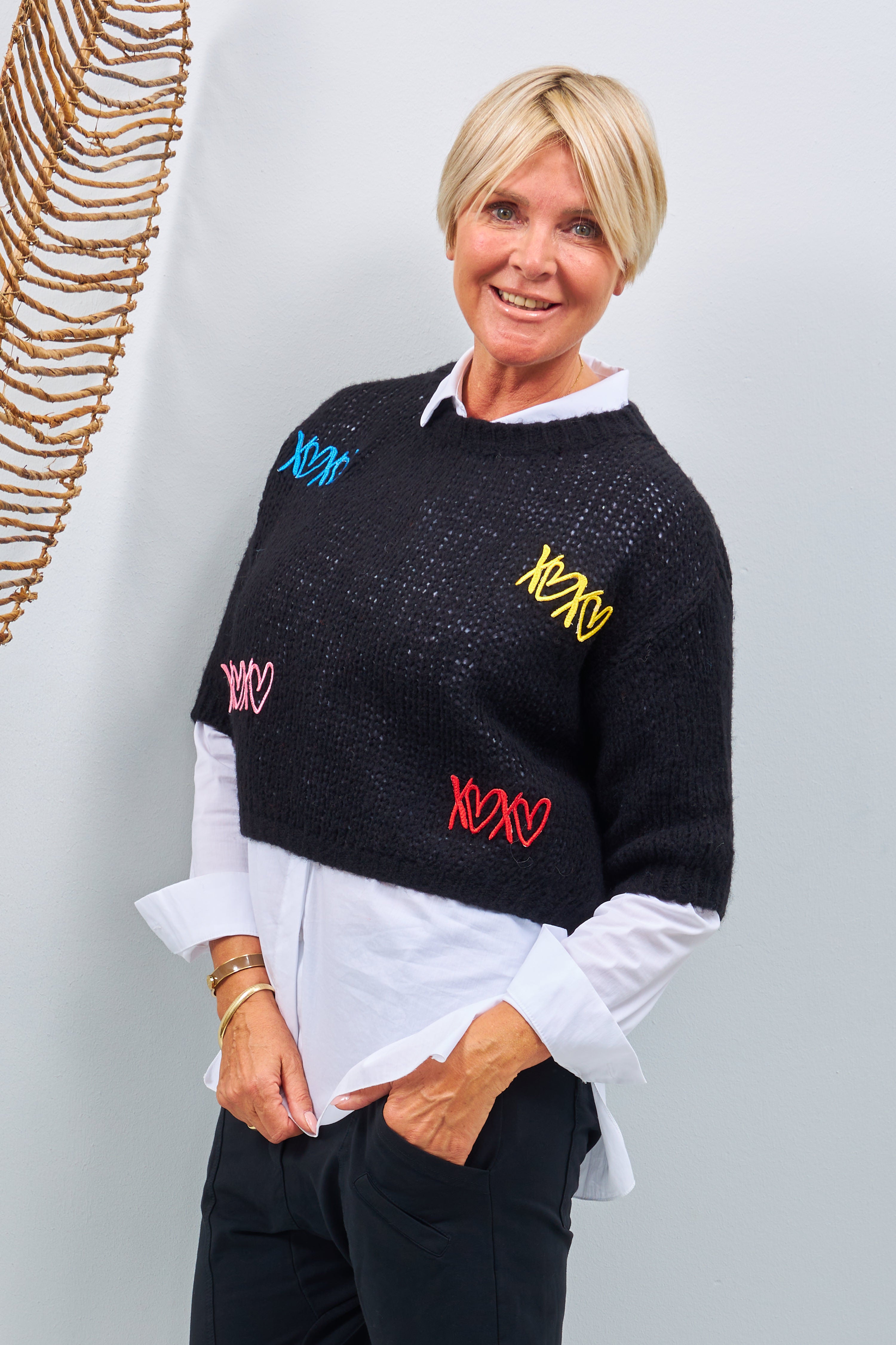 Knit sweater with embroidered hearts, black