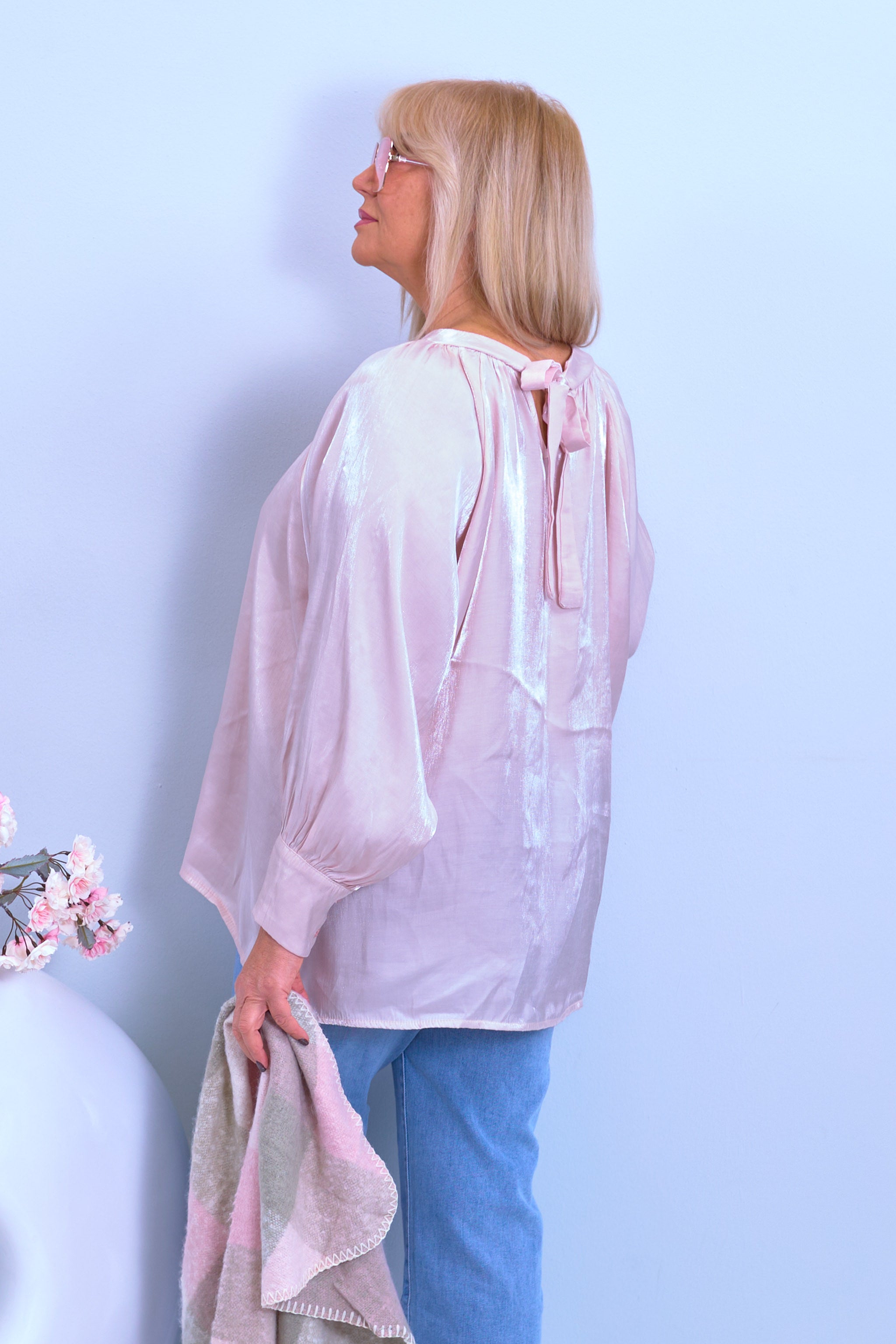 Blouse made of shiny fabric with a bow, light pink