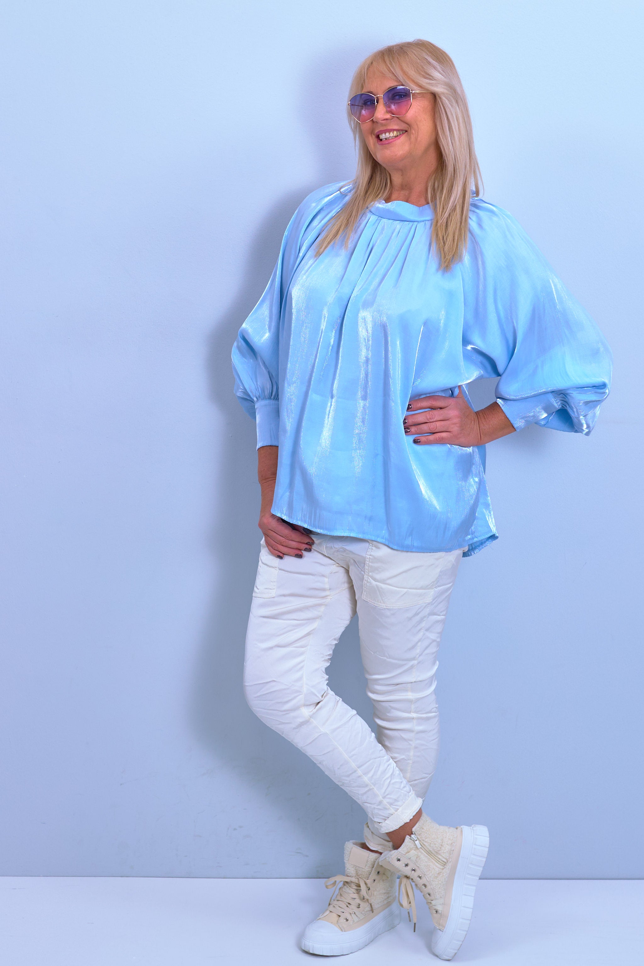 Blouse made of shiny fabric with a bow, light blue