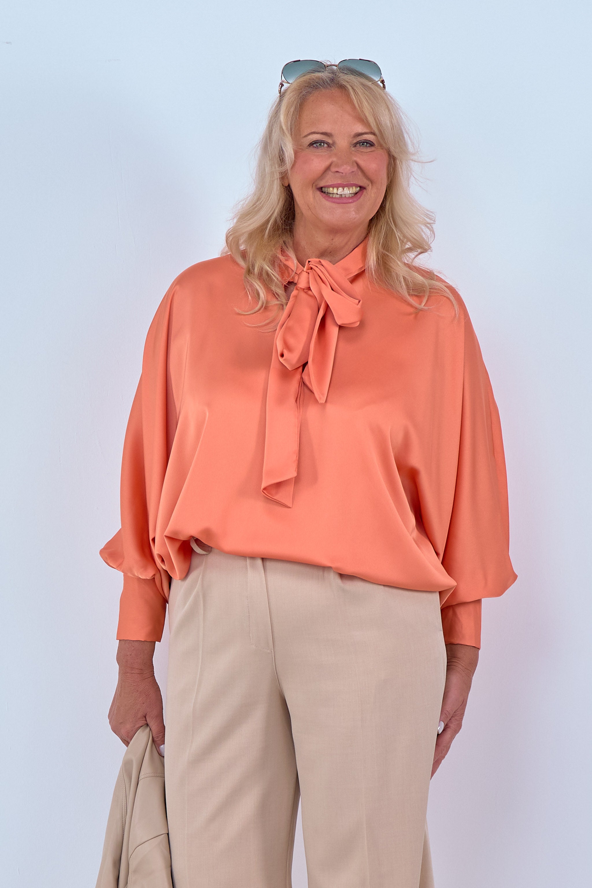 Blouse with batwing sleeves and bow, orange