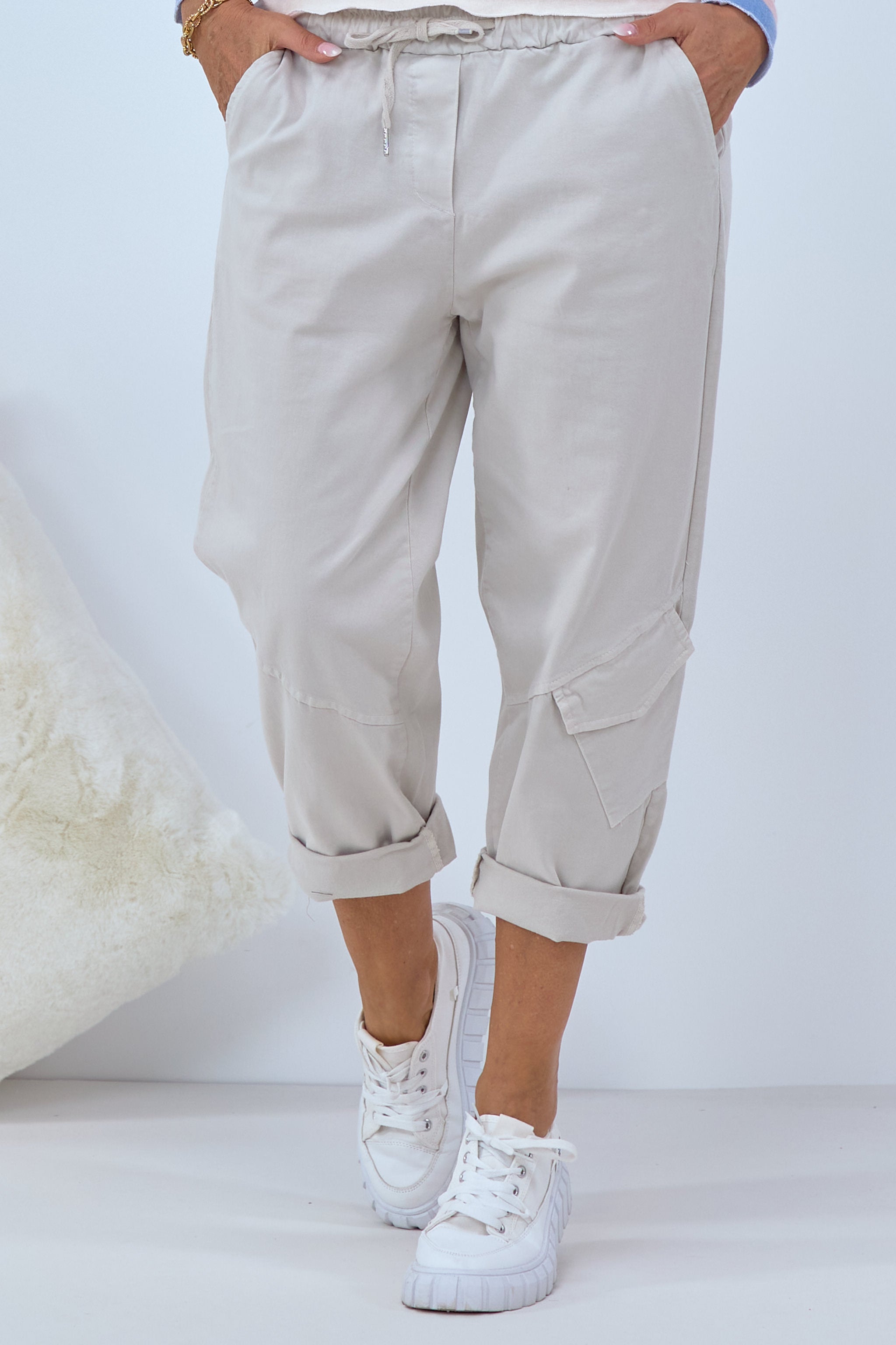 Pants with slanted seams and patch pocket, beige