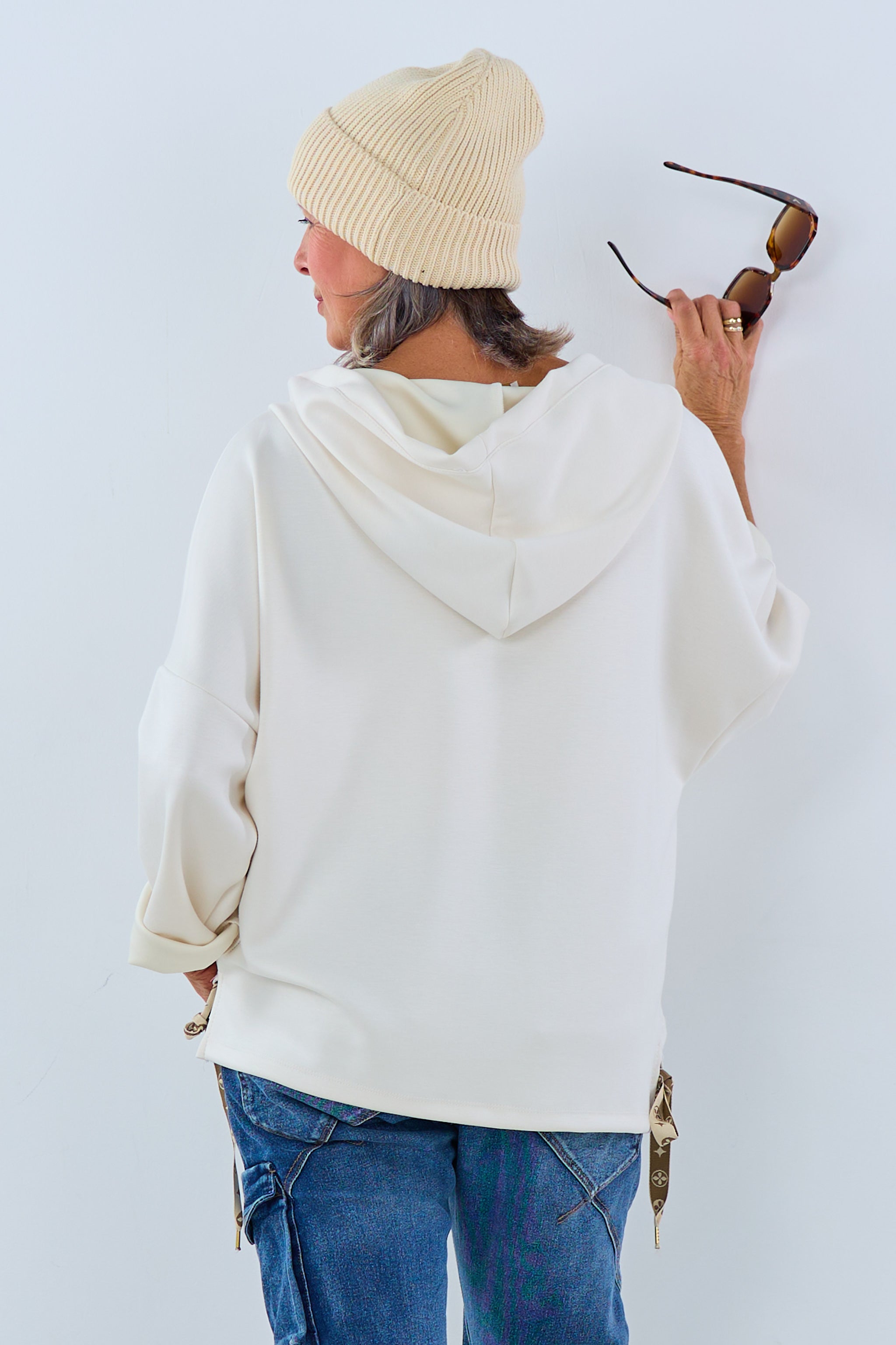 Soft hoodie with ruffles at the waistband, cream