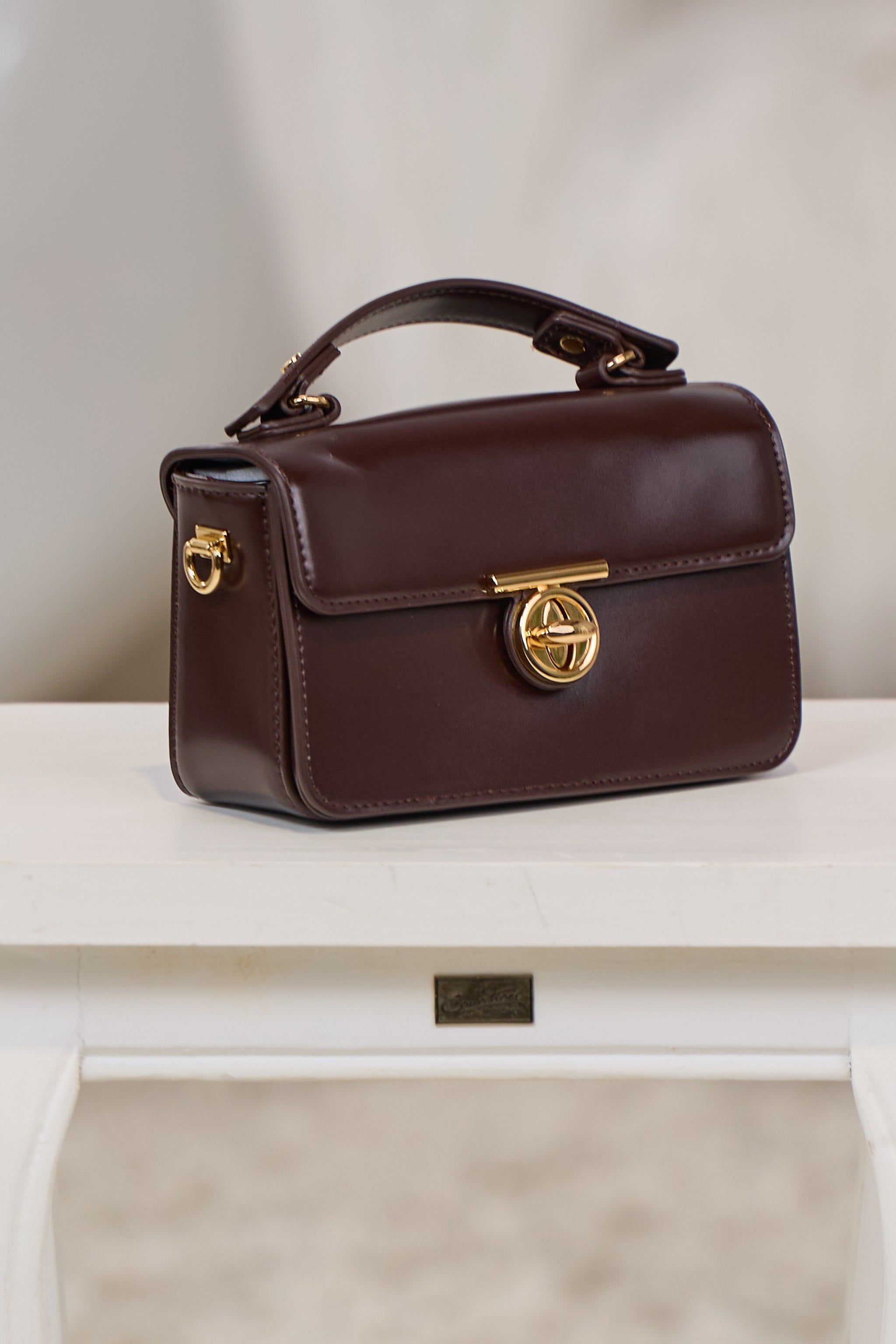 elegante Tasche mit Drehverschluss, dunkelbraun-gold