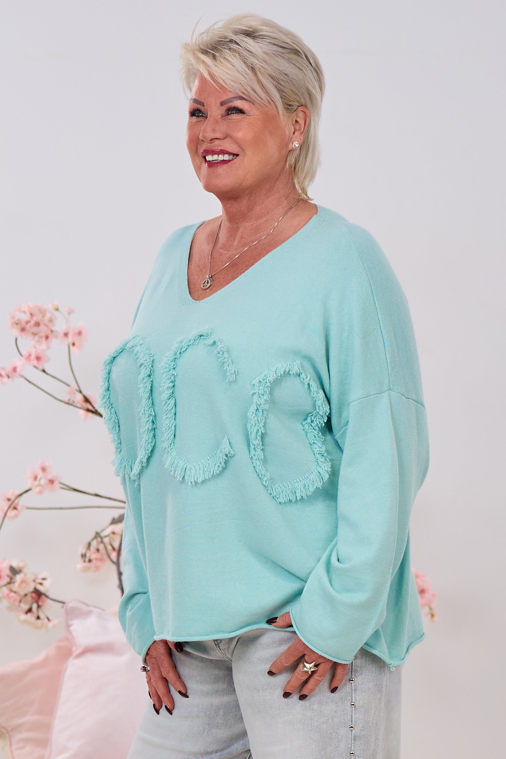 Oversized Strickpulli mit fransigen Buchstaben, mint