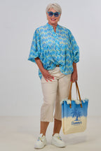 Bluse mit weiten Ärmeln und Lochstickerei, blau-hellblau-limette