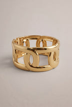breiter Klemmarmreif mit Ösen, gold