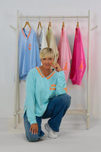 Sweaty NAMASTE by Silvia van Beekum, aqua-neonorange