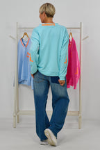 Sweaty NAMASTE by Silvia van Beekum, aqua-neonorange