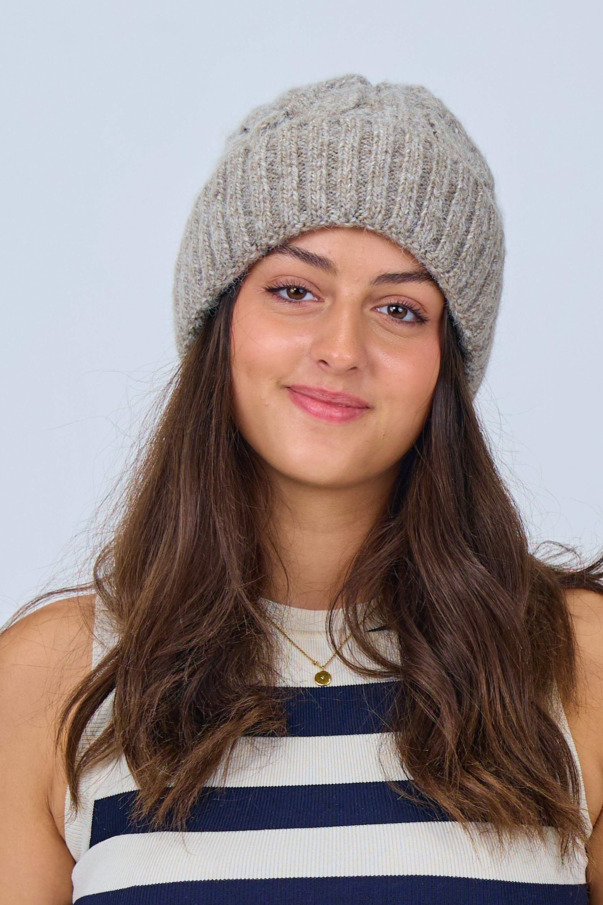 Knitted hat with cable pattern and cuff, taupe